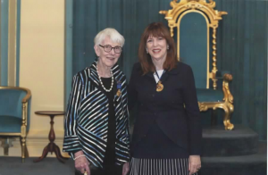 My mum standing with the Governor of Victoria after receiving her medal.